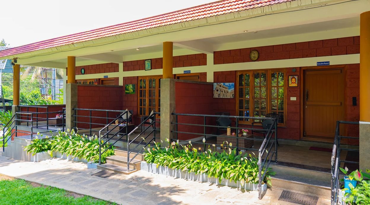 Avocado Cottages Executive Room | Pet-friendly Stay With Private Patio & Common Garden